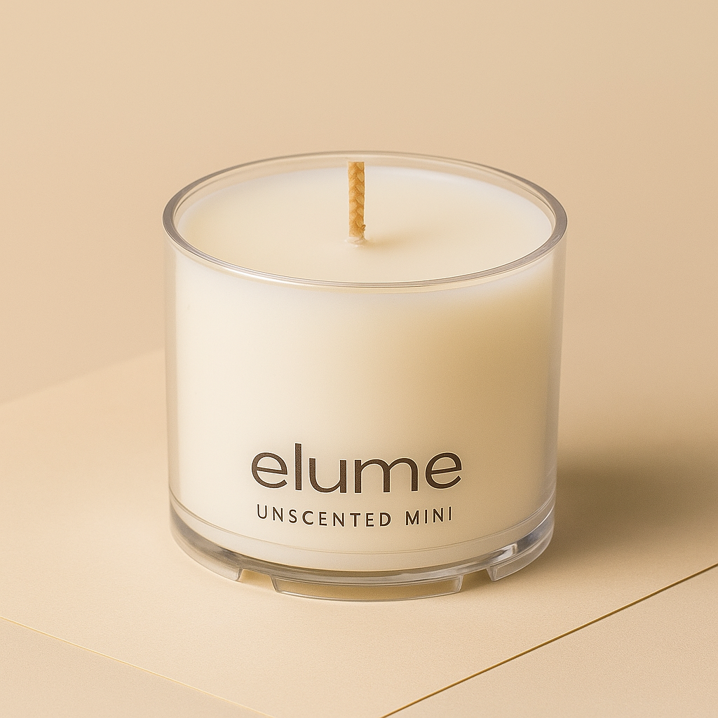 Elume unscented mini candle on a beige background