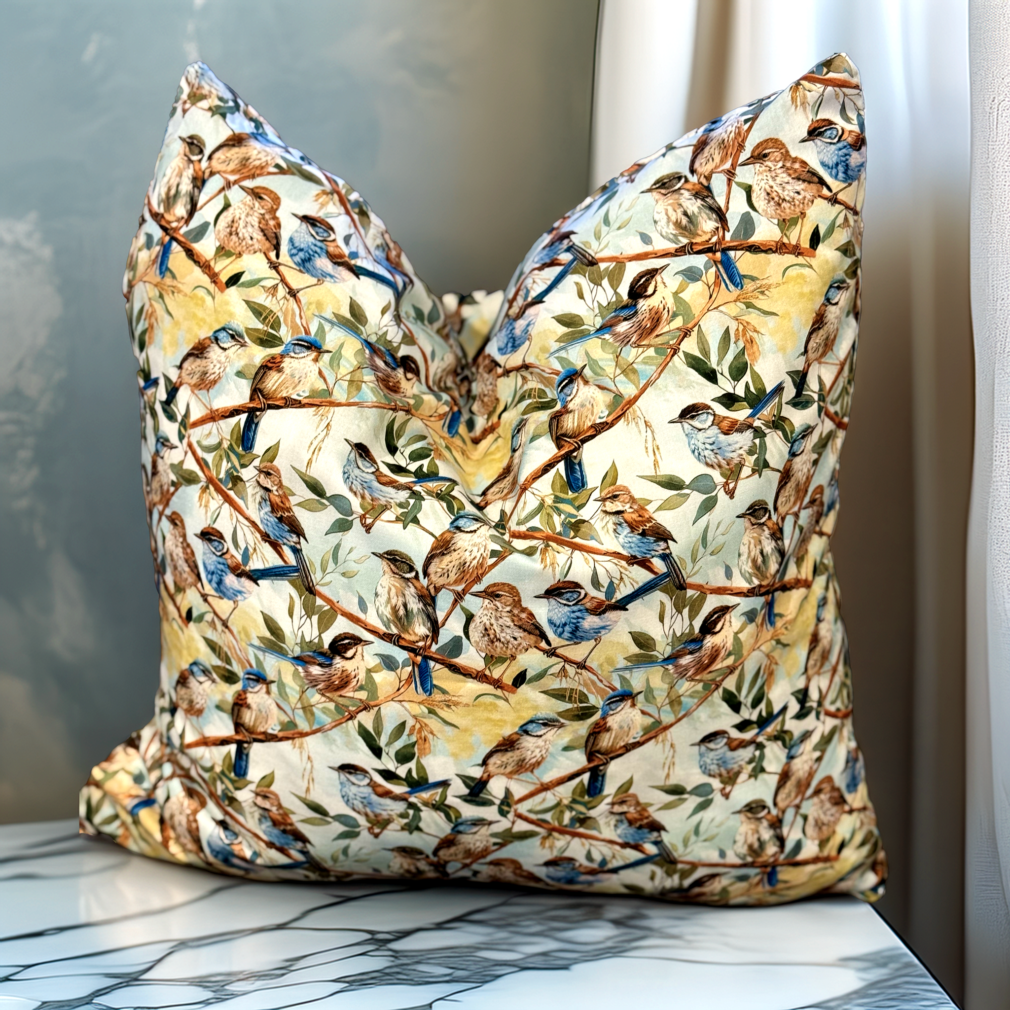 Handmade designer cushion featuring Blue Fairy-wrens perched among native branches. Luxe & Humble premium cushion with feather insert, available Australia-wide.