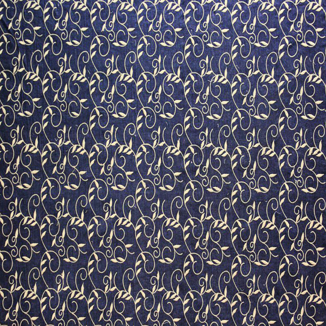 Forged Denim Fabric featuring a delicate swirl pattern in beige on a rich denim background, ideal for upholstery and home décor by Luxe & Humble.