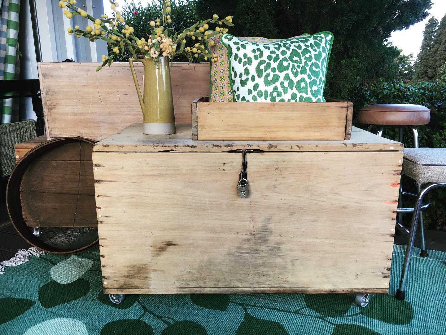 Luxe & Humble styled trunk with bespoke Anna Spiro 'Flora' and Schumacher 'Leopard' cushions atop it. 