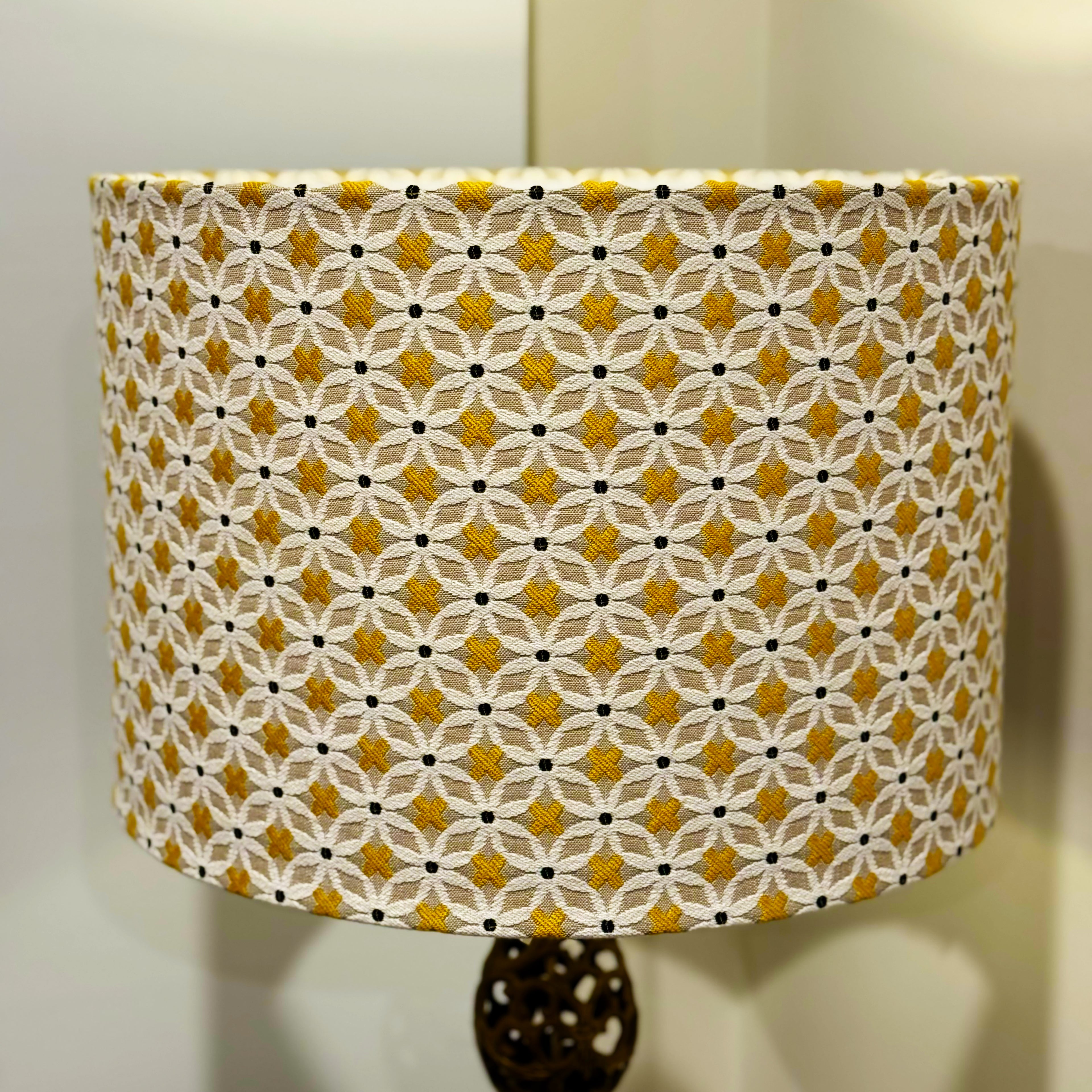 Patterned lampshade with yellow and black design on a neutral background
matching set