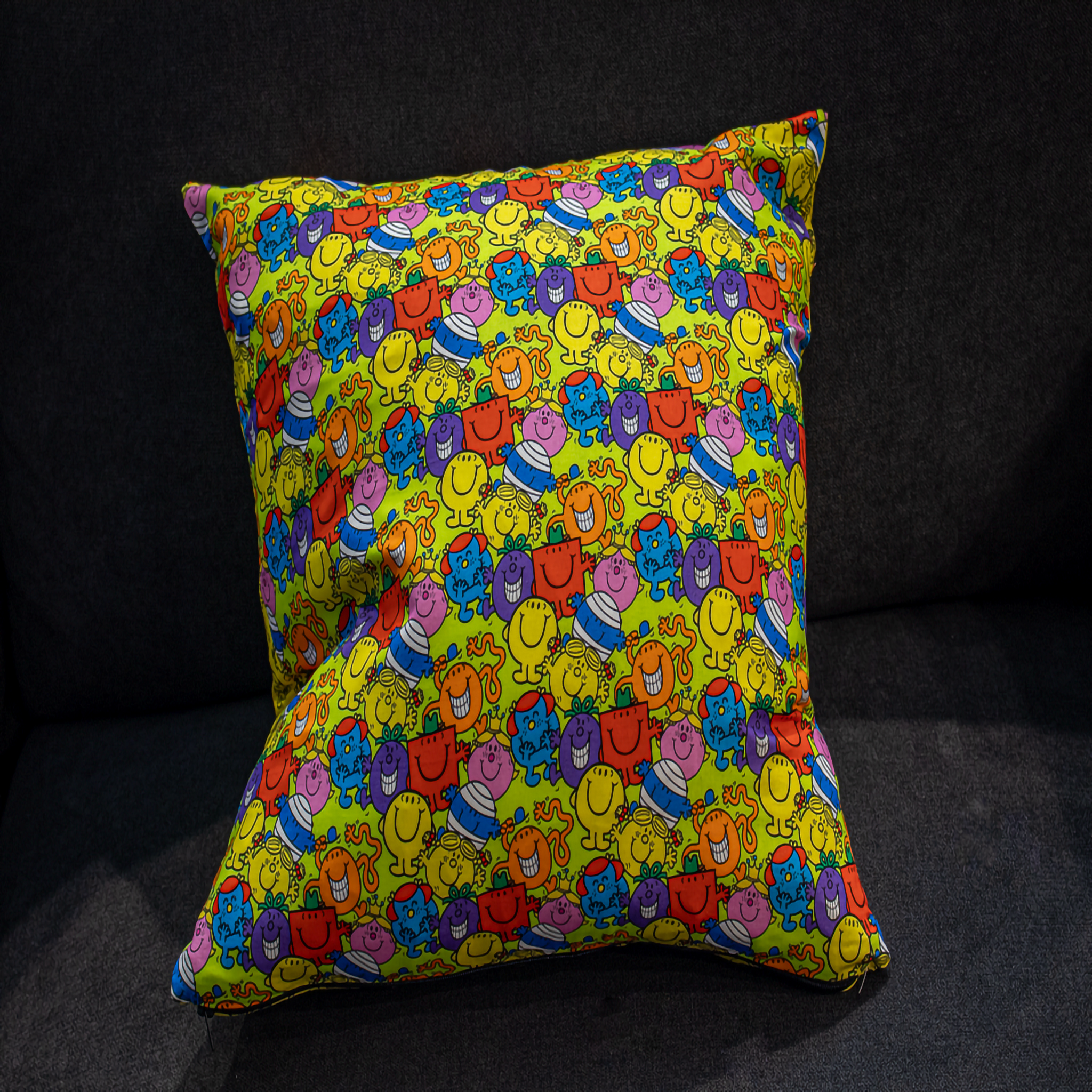 Reversible cushion featuring a bold and colorful all-over Mr. Men & Little Miss design on a bright yellow background. This 50 x 50 cm pillow is playful and nostalgic, perfect for kids’ rooms, playrooms, or fans of classic storybook characters. Luxe & Humble exclusive.