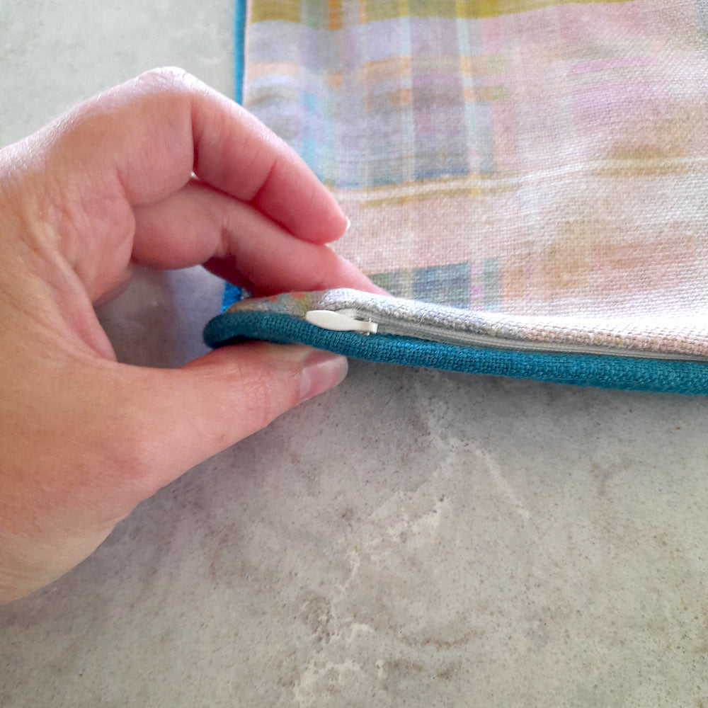Close up of the zip on a bespoke Anna Spiro 'Tattie' cushion manufactured by Luxe & Humble.