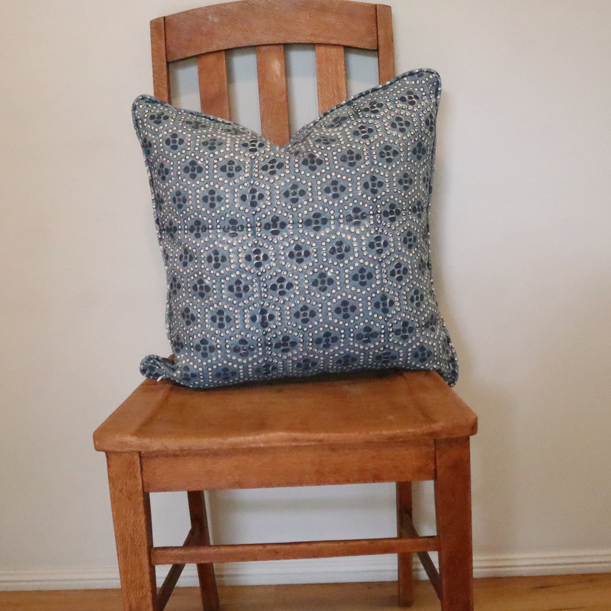 Ash Block Printing - Mewari - Denim 55cm Scatter Cushion on a chair.