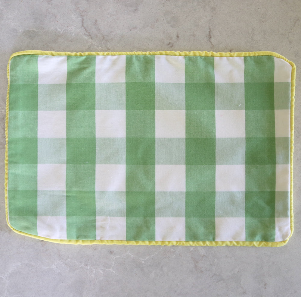 Green gingham cushion with sunshine yellow piping