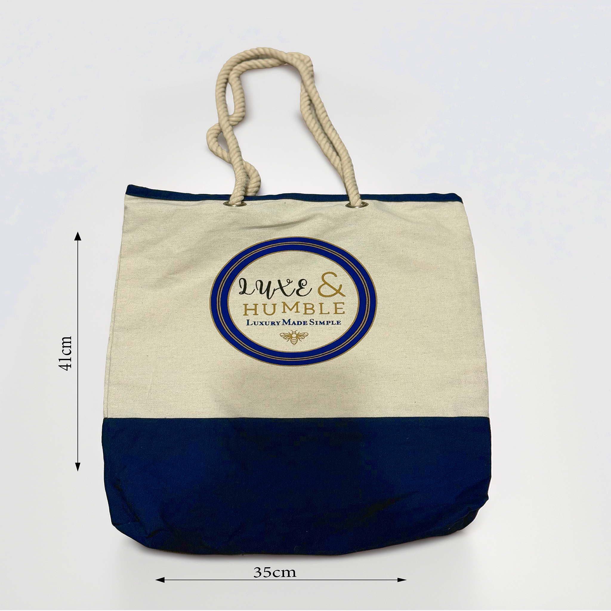 A product image of the Luxe & Humble canvas tote bag showing its exact measurements: 41cm high and 31cm wide. Features natural canvas, navy base panel and rope handles on a clean white background. Ideal for Australian shoppers wanting precise size reference.