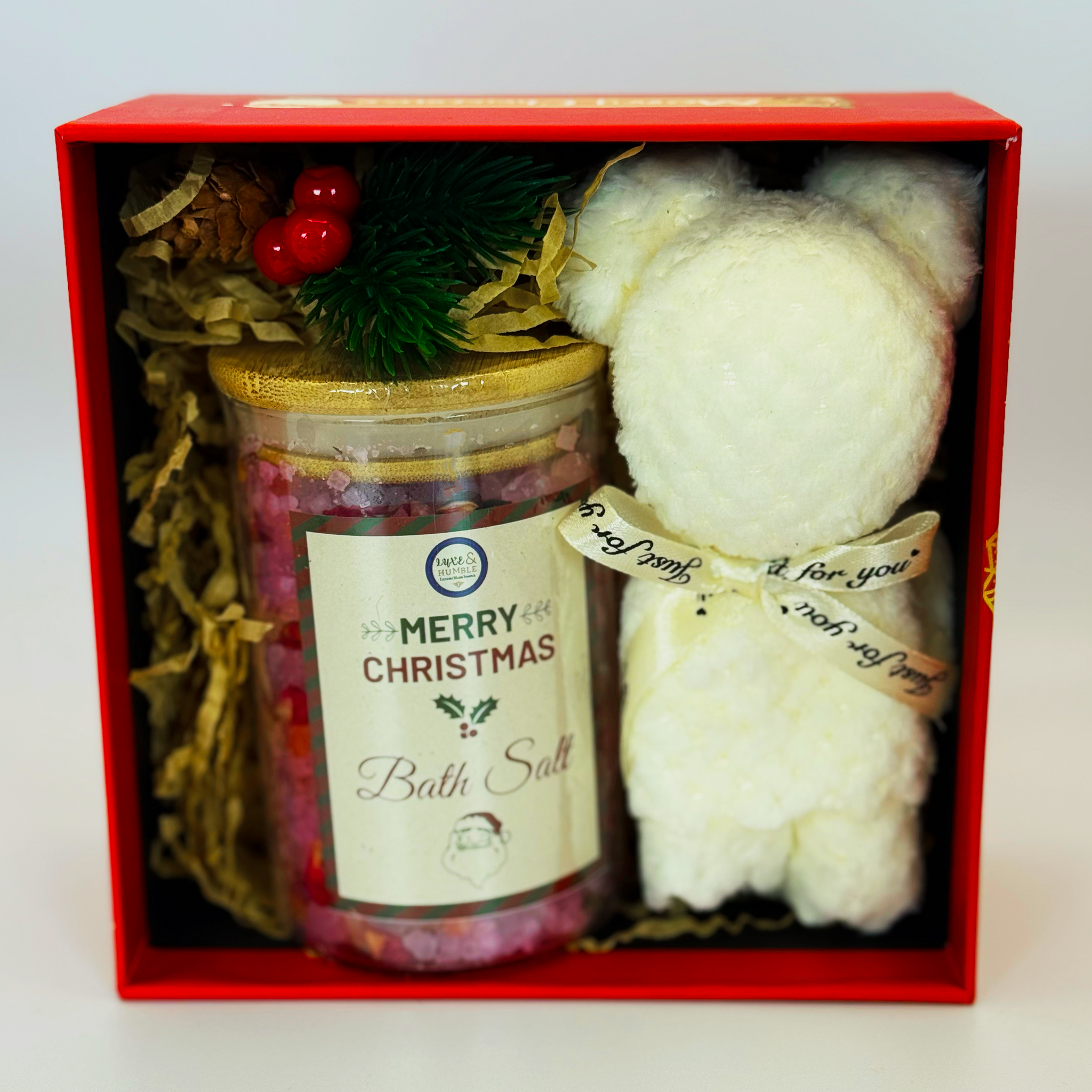 A red Luxe & Humble Christmas gift box containing a jar of colourful bath salts and a white plush bear tied with decorative ribbon. Photographed on a clean studio background, ideal for Christmas gift shopping, Australian handmade gifts and festive pamper boxes.