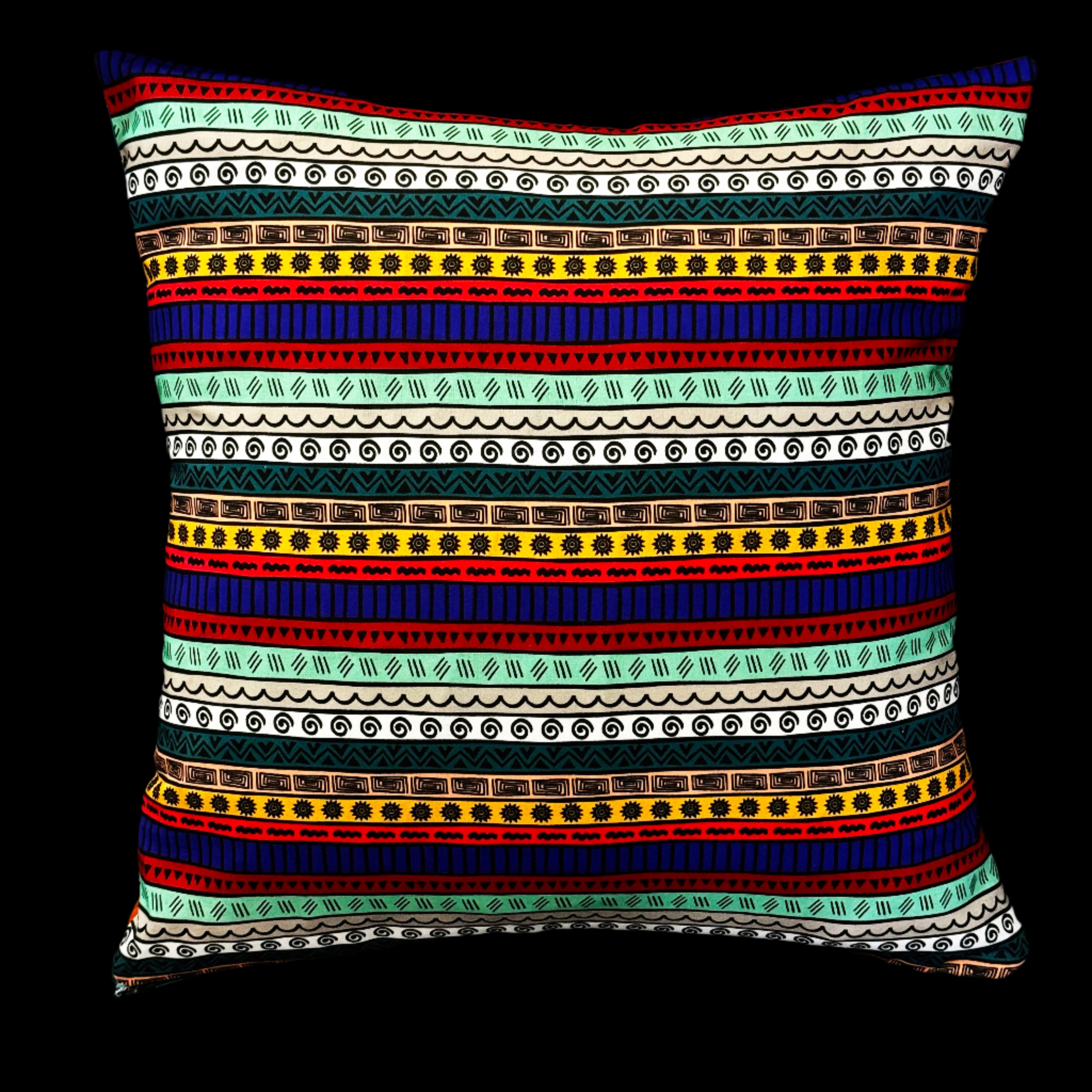 Reversible pillow styled on dark sofa – Luxe & Humble tribal and playful interiors