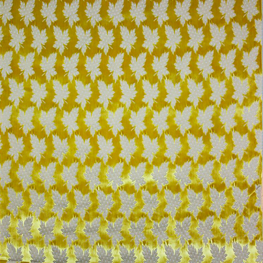 Foglie Gold Fabric showcasing an intricate maple leaf motif in gold on a rich cotton blend cut velvet background.
