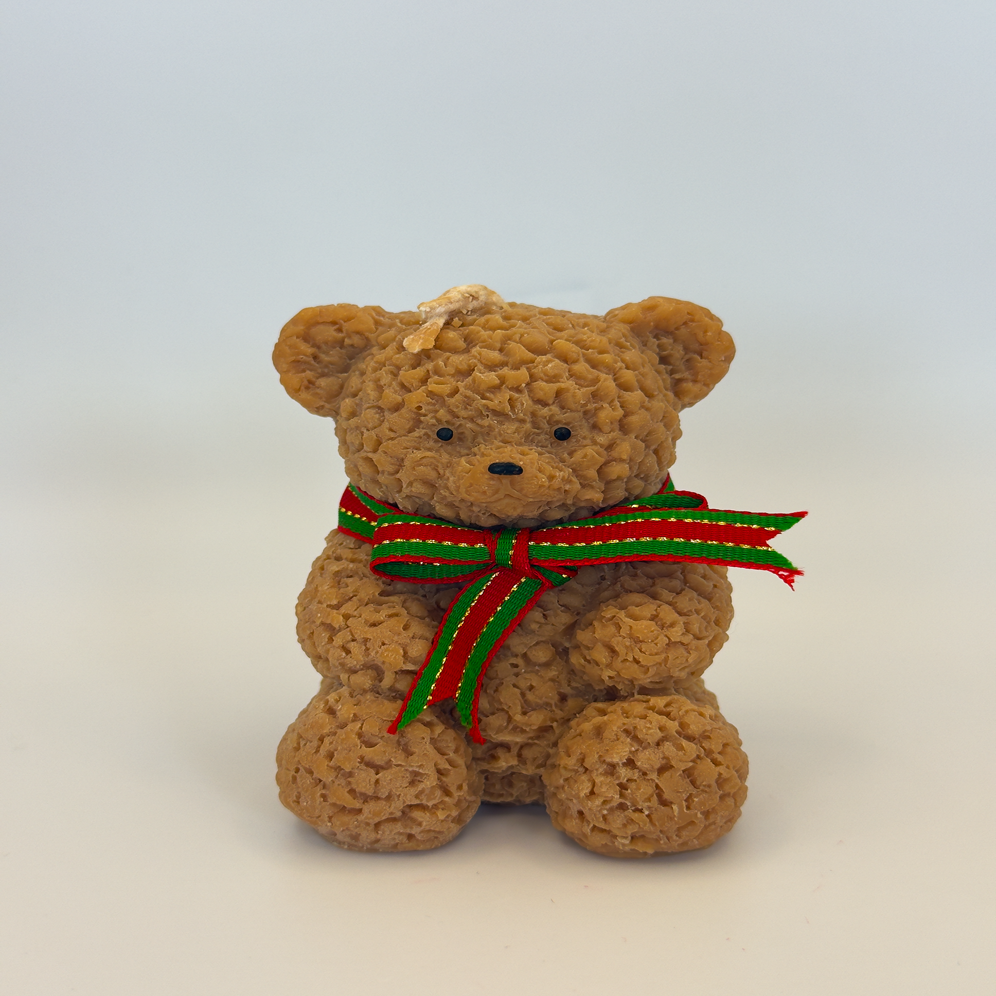 Cute brown textured teddy bear Christmas candle with a red and green festive ribbon, sitting upright on a clean white background – Luxe & Humble Australia.