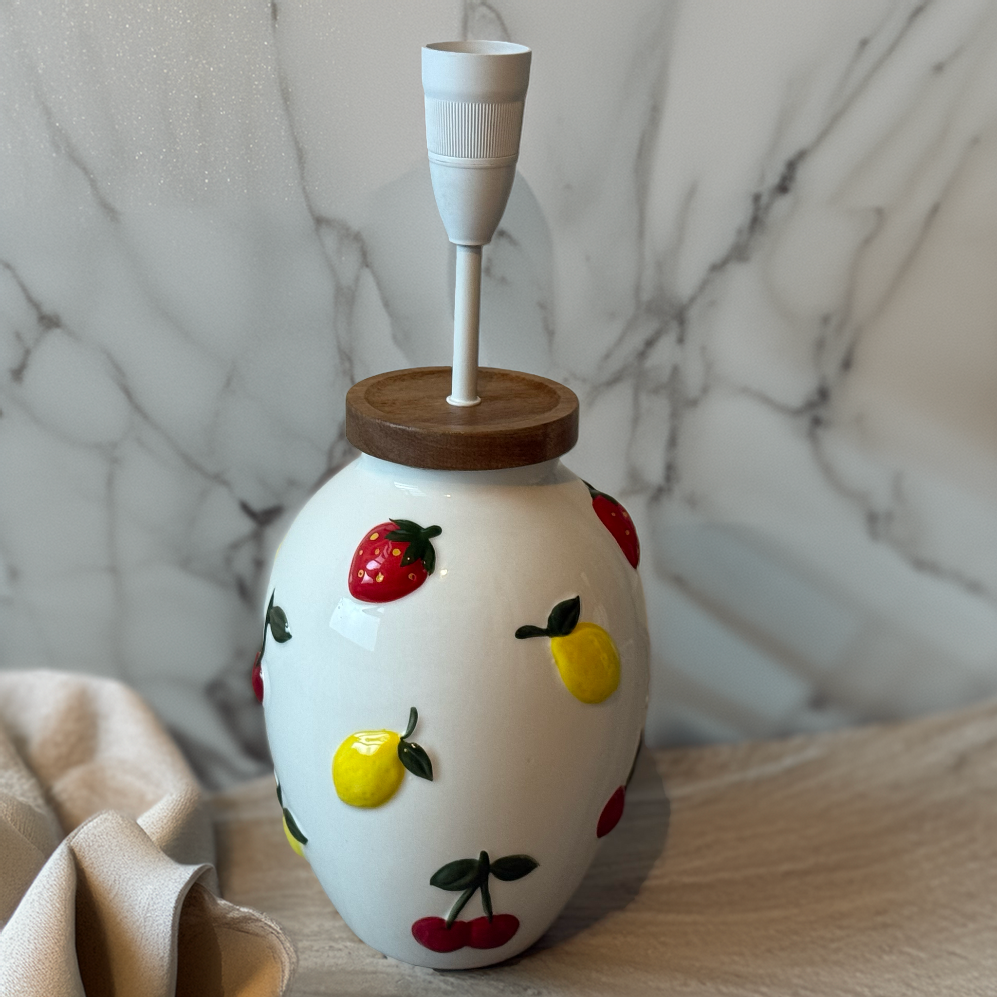 Exclusive Fruit Motif Ceramic Lamp Base handmade by B. Bailey Design Co. for Luxe & Humble. Features strawberries, lemons & cherries with natural timber top.