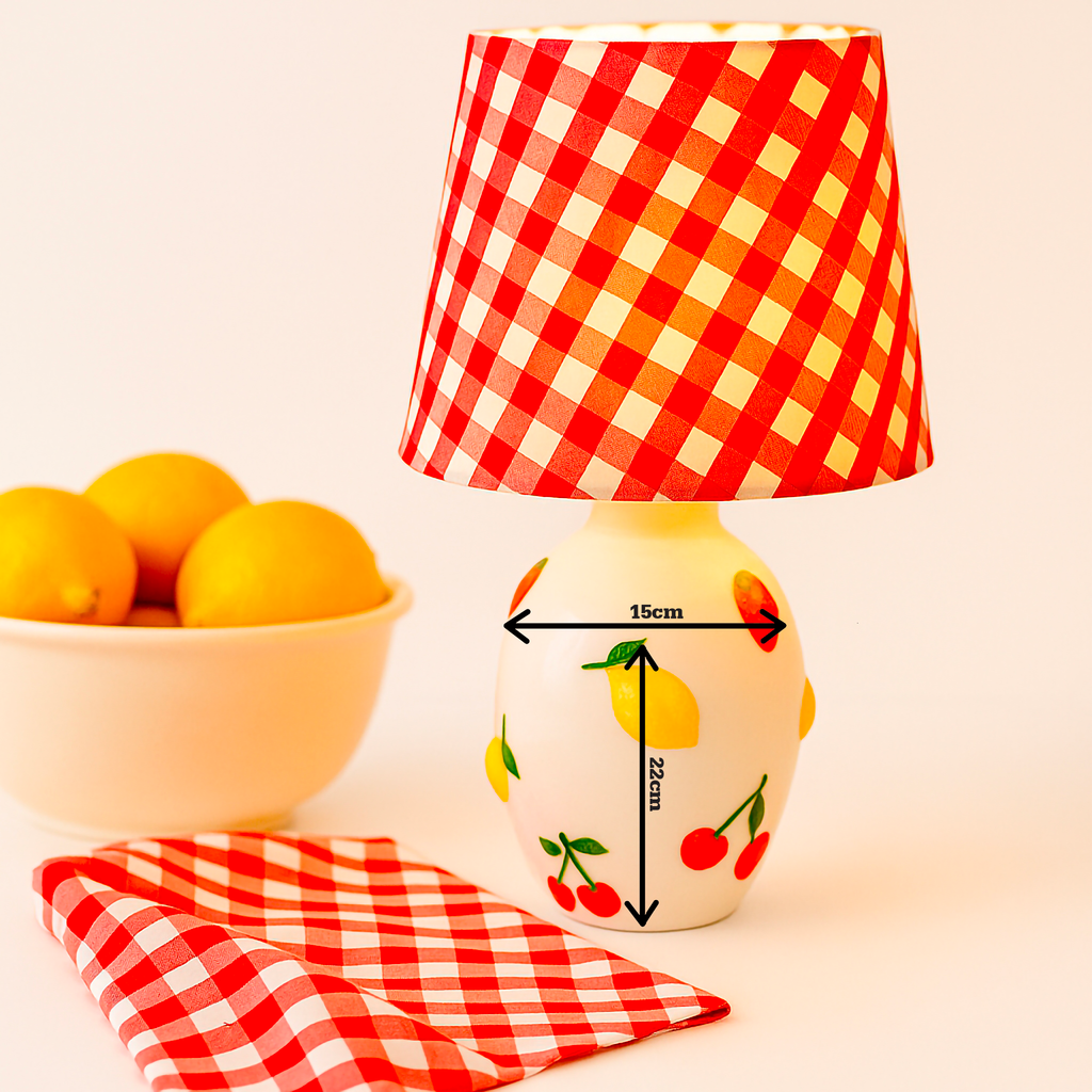 A handcrafted Fruit Motif Ceramic Lamp Base adorned with cherries, lemons, and strawberries, paired with a bold red gingham fabric lampshade. Designed by B.Bailey.Design.Co Australia, this playful yet timeless lamp captures modern nostalgia and artisan charm. Perfect for adding warmth, character, and colour to Australian homes.