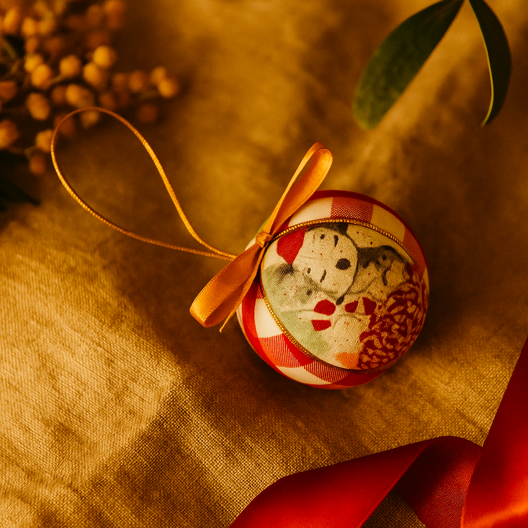Handcrafted gingham Christmas bauble featuring a festive koala design, gold ribbon, and soft linen background — designed and made in Australia by Luxe & Humble.