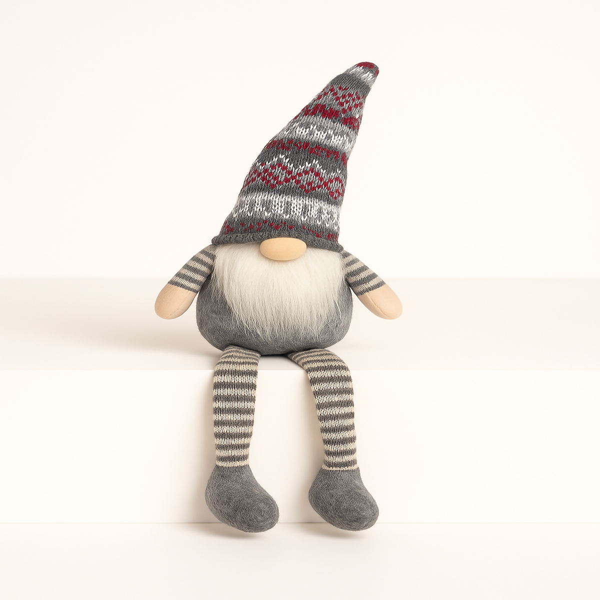 Grey Nordic Christmas Gnome 39cm tall with knitted red and white patterned hat, long striped legs and fluffy white beard – sitting shelf décor figurine for Australian Christmas styling by Luxe & Humble.