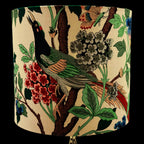 Decorative lampshade with bird and floral pattern on a beige background