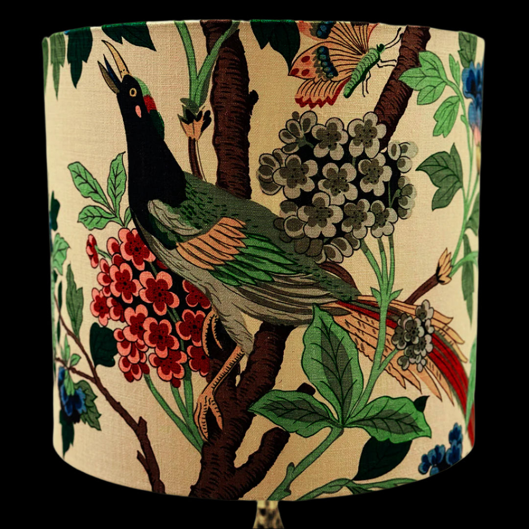 Decorative lampshade with bird and floral pattern on a beige background