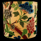 Decorative lampshade with floral and bird pattern on a beige background