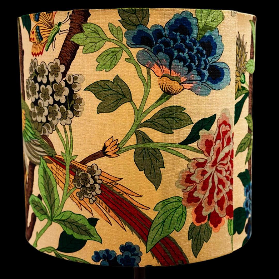 Decorative lampshade with floral and bird pattern on a beige background