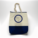 A high-quality product photo of the Luxe & Humble canvas tote bag displayed upright on a clean white background. The bag features a natural canvas upper, navy base, thick rope handles, and the signature Luxe & Humble round logo. Crisp, clear and ideal for Australian shoppers wanting a detailed view of the bag’s design and craftsmanship.