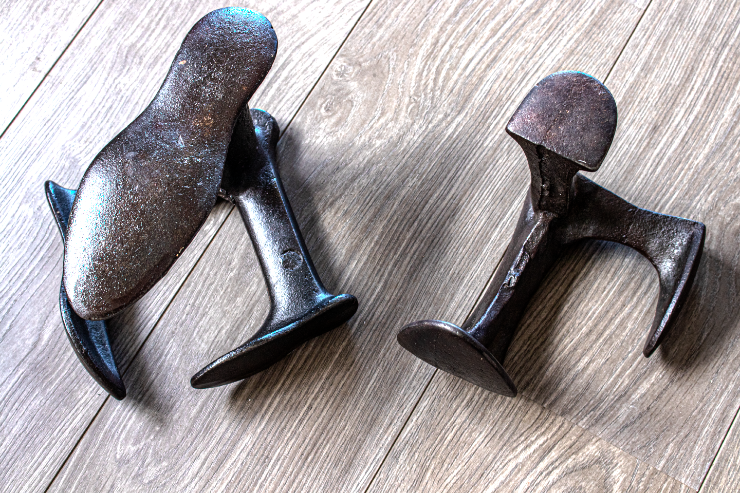 A photo of two cast iron cobblers anvils available to purchase. 