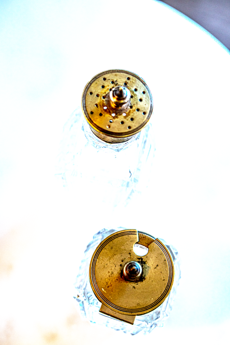 Cut glass and silver condiment bottles with silver lids - lids photo