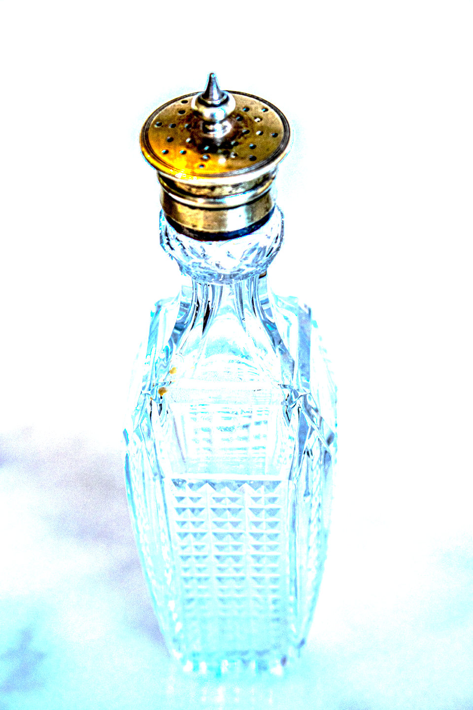 Vintage cut glass condiment bottles with silver lids - x 2