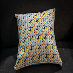 Reversible pillow featuring vibrant blue and white Mickey Mouse patterns, adding a playful and colorful touch to your home decor.