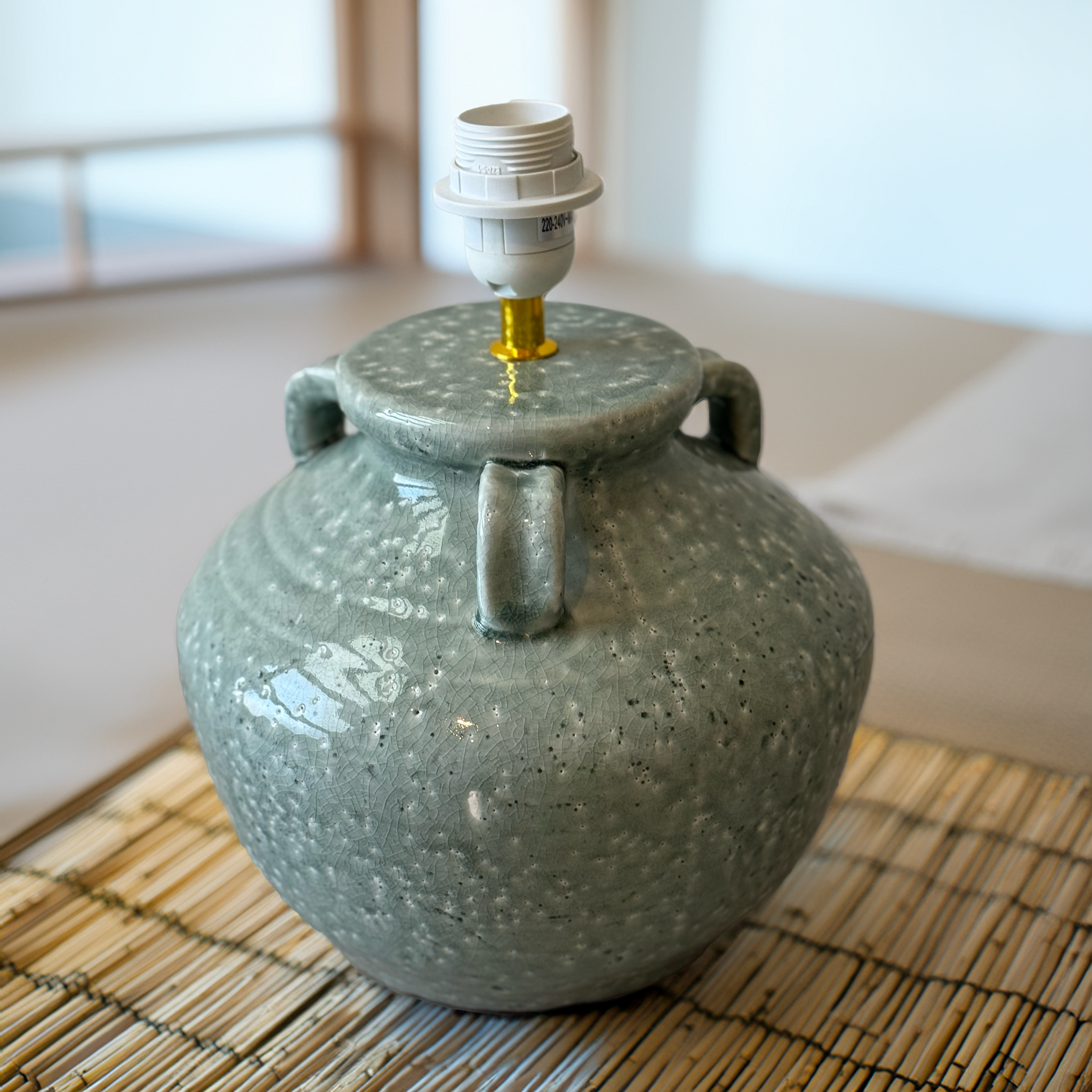 Shop the Mist Glaze Lamp Base, a Wabi Sabi style ceramic lamp base with sage-green crackle glaze. Organic, handcrafted design available at Luxe & Humble.