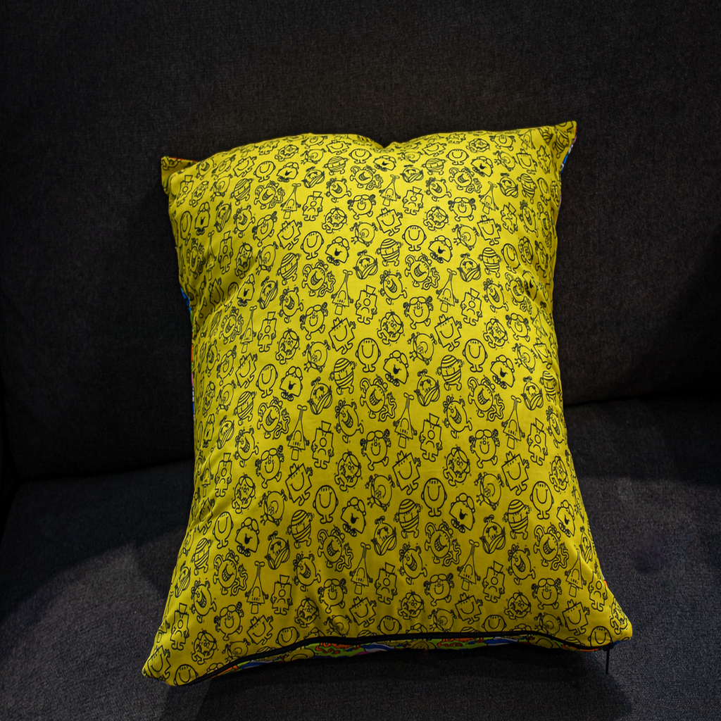Reversible cushion with a minimalist Mr. Men & Little Miss outline print in black on a solid yellow background. A stylish 50 x 50 cm pillow that blends playful character design with modern simplicity. Luxe & Humble exclusive.