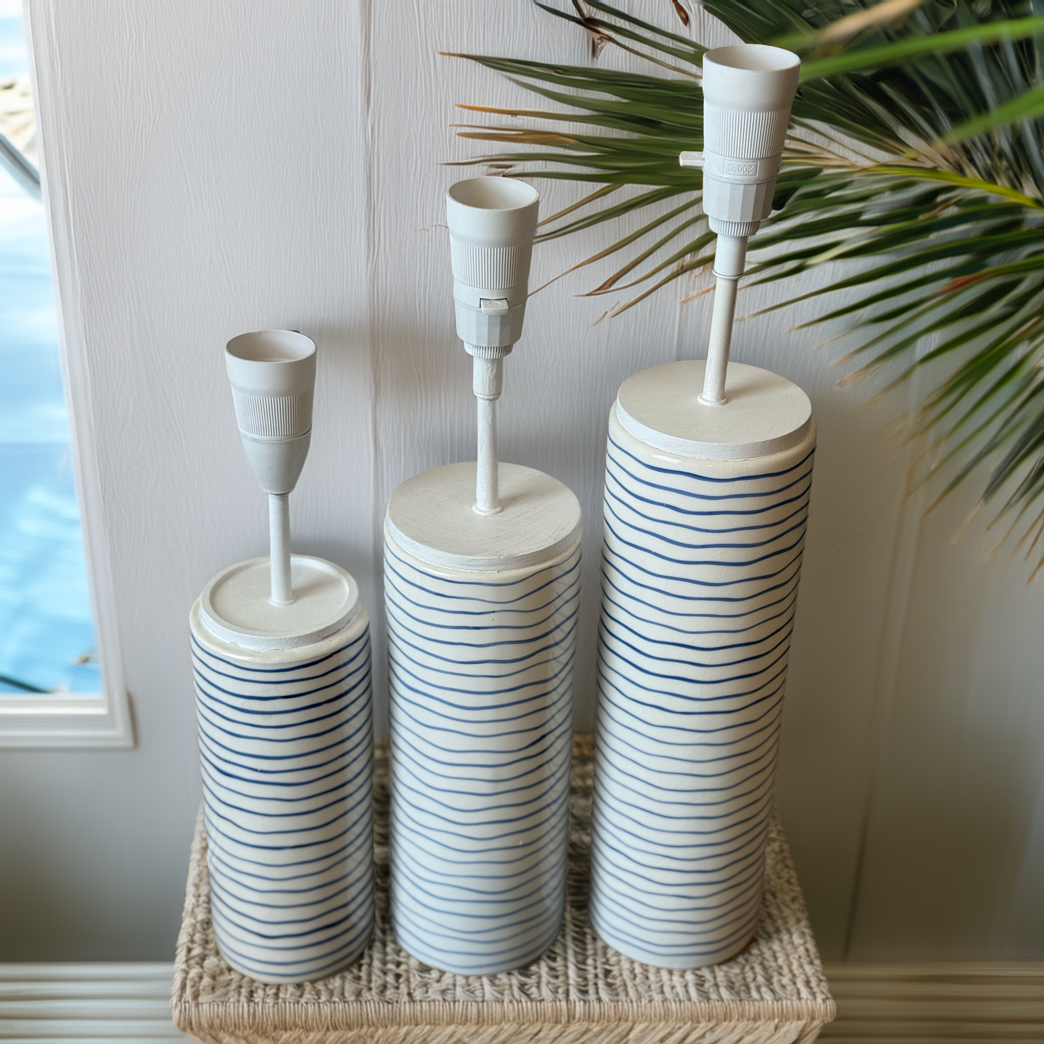 Ocean Ripple Lamp Base by B.Bailey Design Co., exclusive to Luxe & Humble. White ceramic with hand-painted navy ripple lines, available in three sizes.
