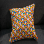 Reversible cushion featuring a bold rainbow arches design in vibrant orange, pink, blue, and yellow. This 50 x 50 cm pillow adds cheerful color and playful charm to any living room, bedroom, or kids’ space. Luxe & Humble exclusive.