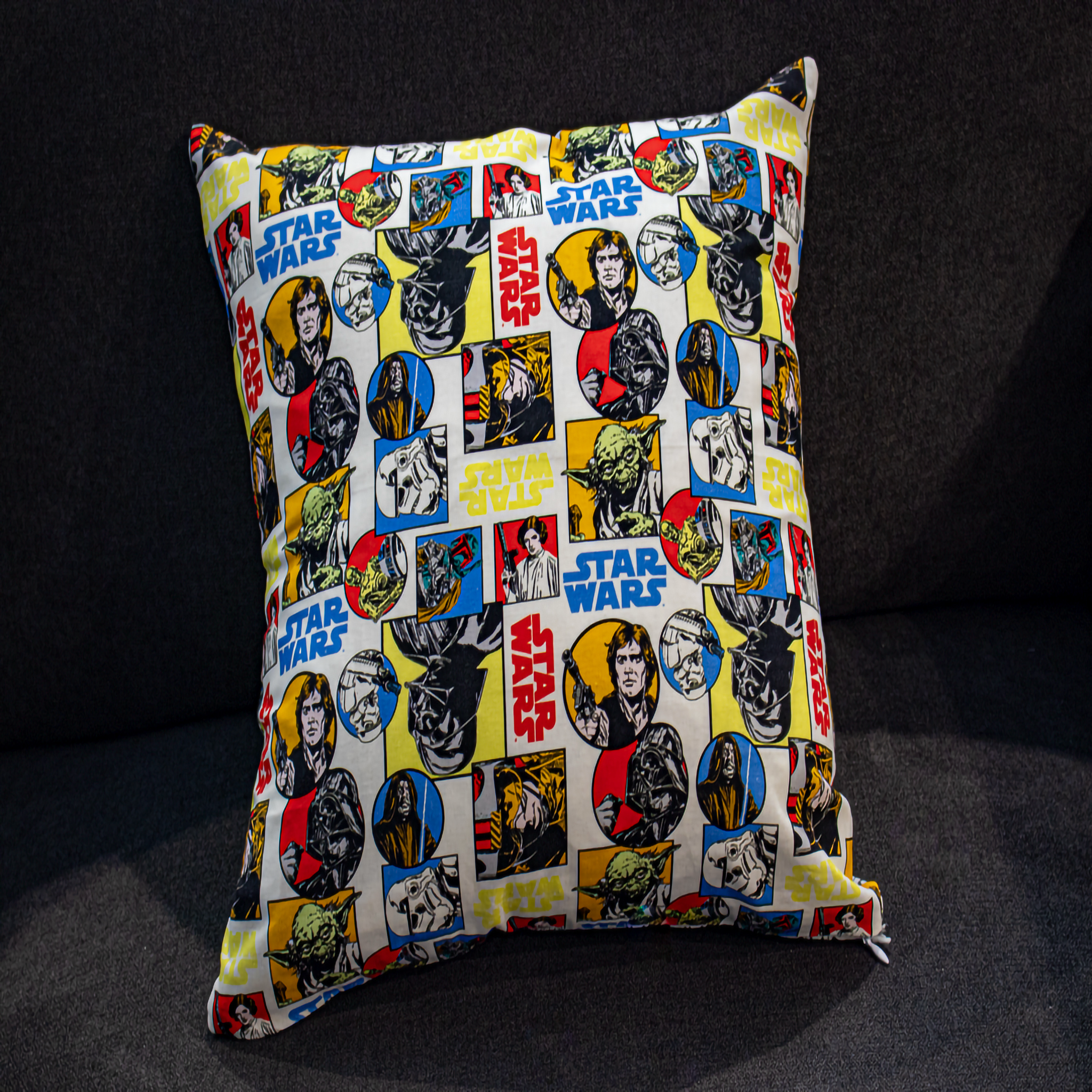 Reversible Star Wars cushion featuring a vibrant collage of characters including Luke Skywalker, Yoda, Darth Vader, and more. This 50 x 50 cm pillow adds a bold pop of color and fandom to living rooms, bedrooms, or home theatres. Luxe & Humble exclusive.