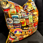 Decorative pillow with vintage-style tins of coffee and other products on a dark background by luxe and humble, Australia wide shipping. 
