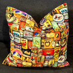 Handmade cushion featuring a colourful Vintage Tin Cans retro print with coffee, tea, and pantry labels. Luxe & Humble cushion with feather insert, available Australia-wide.