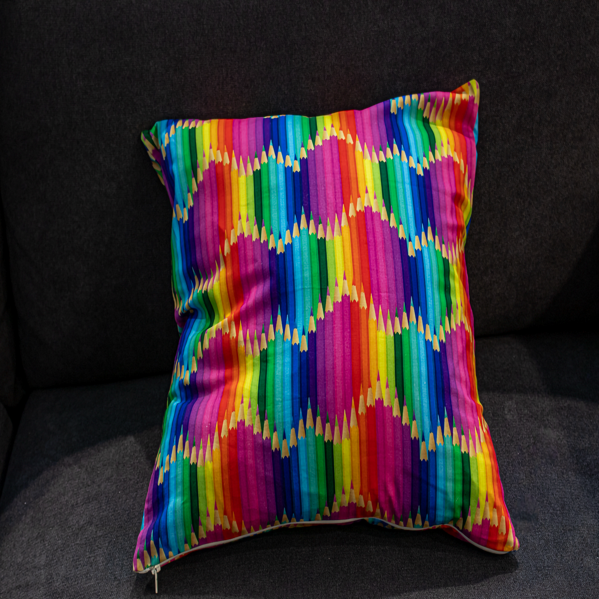 Colorful pillow cover featuring a playful rainbow pencil pattern, adding a fun and vibrant touch to your décor.