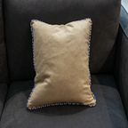 Beige pillow cover with blue geometric piping and blue geometric reverse side, offering an elegant touch to your home décor.
