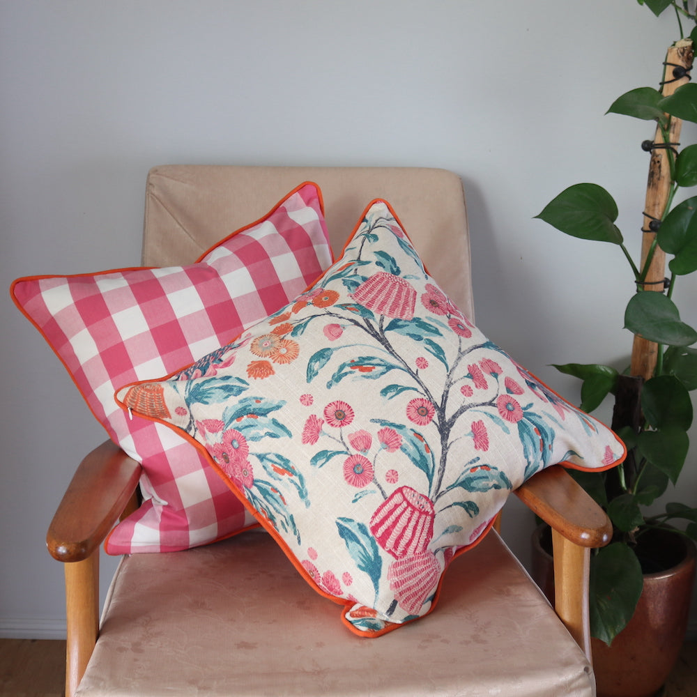 Pink Gingham Cushion with Orange Piping & Pink and Orange Native Floral Cushion