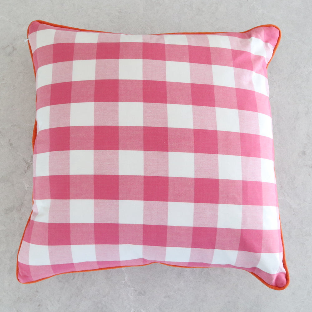 Pink Gingham Cushion with Orange Piping. 