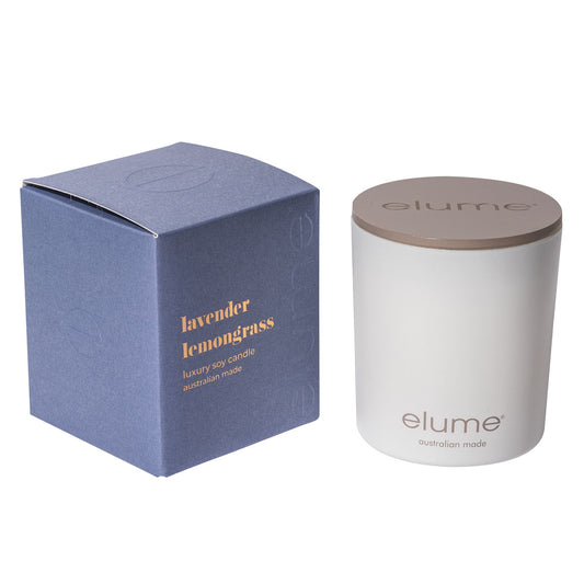 Elume Lavender Lemongrass Soy Candle Box, sitting beside the Candle with its lid on.